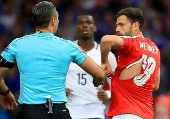 بالصور.. سر تمزق قمصان لاعبي سويسرا في "يورو 2016"