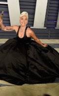 10249502-6741777-Live_for_the_applause_Gaga_showed_off_her_gown_as_she_sat_down_o-a-514_1551090060020.jpg